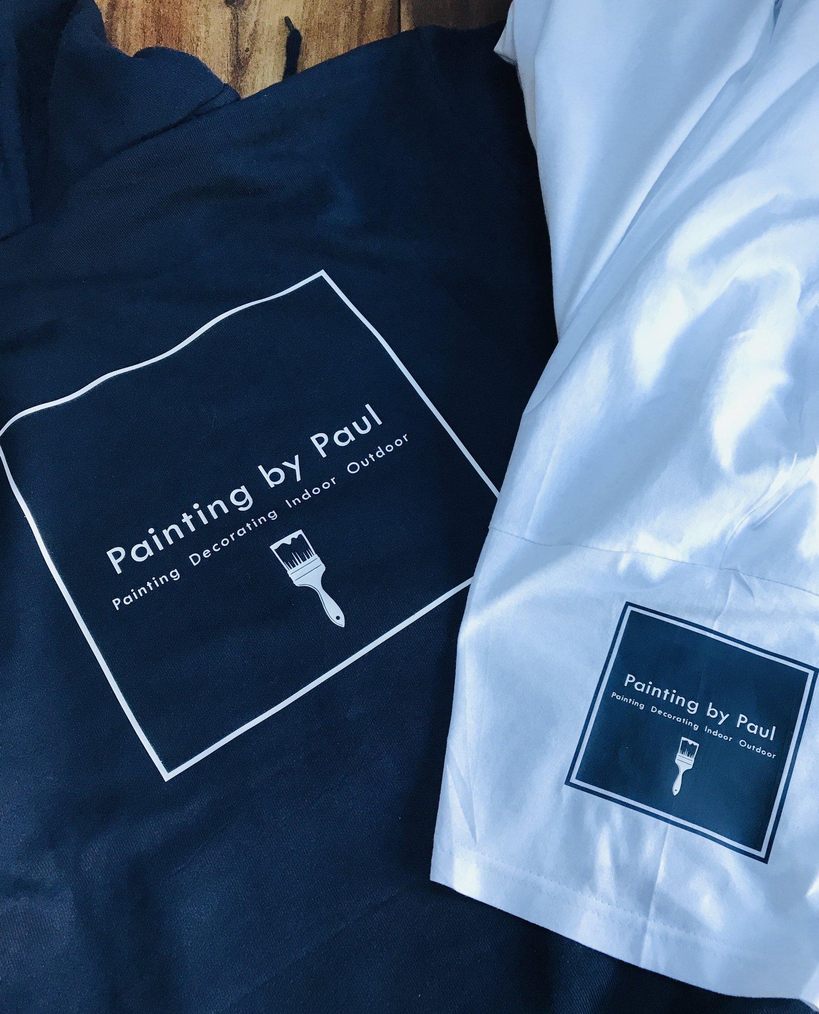 Painting by Paul branded navy and white workwear