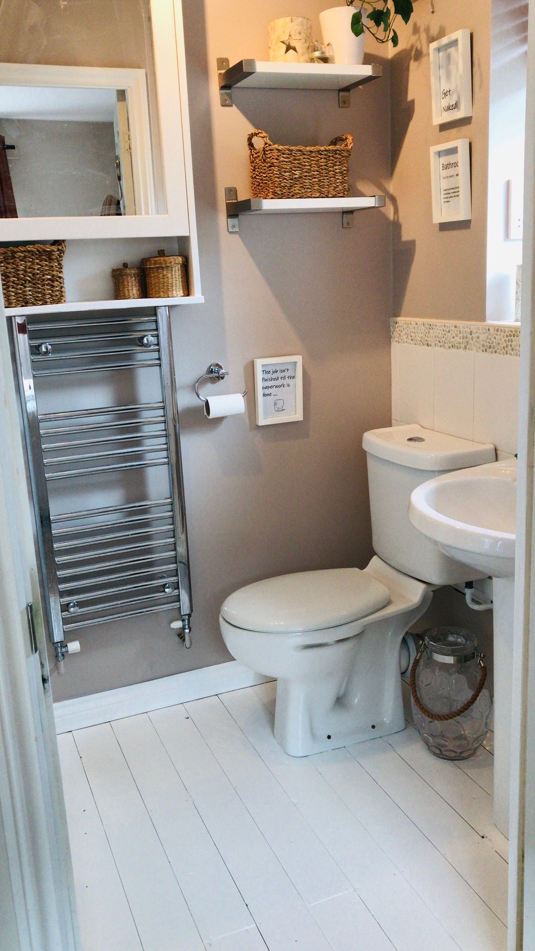 Cloakroom in warm taupe with white painted floorboards