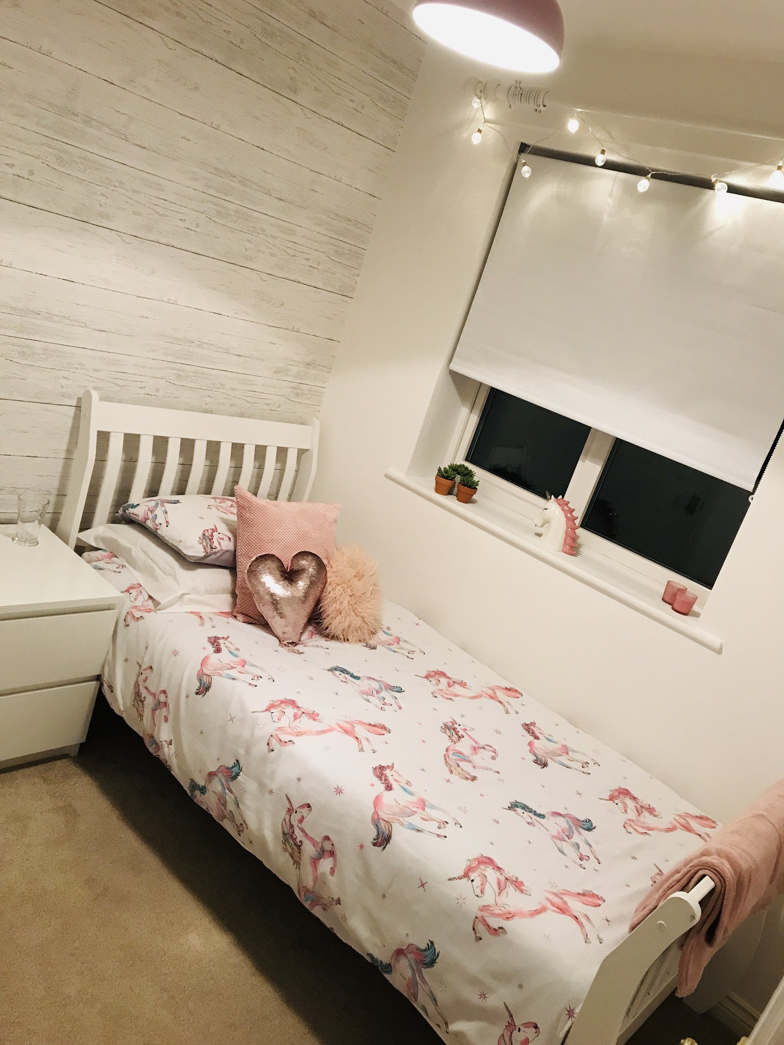 Child's bedroom with white wood-effect feature wallpaper