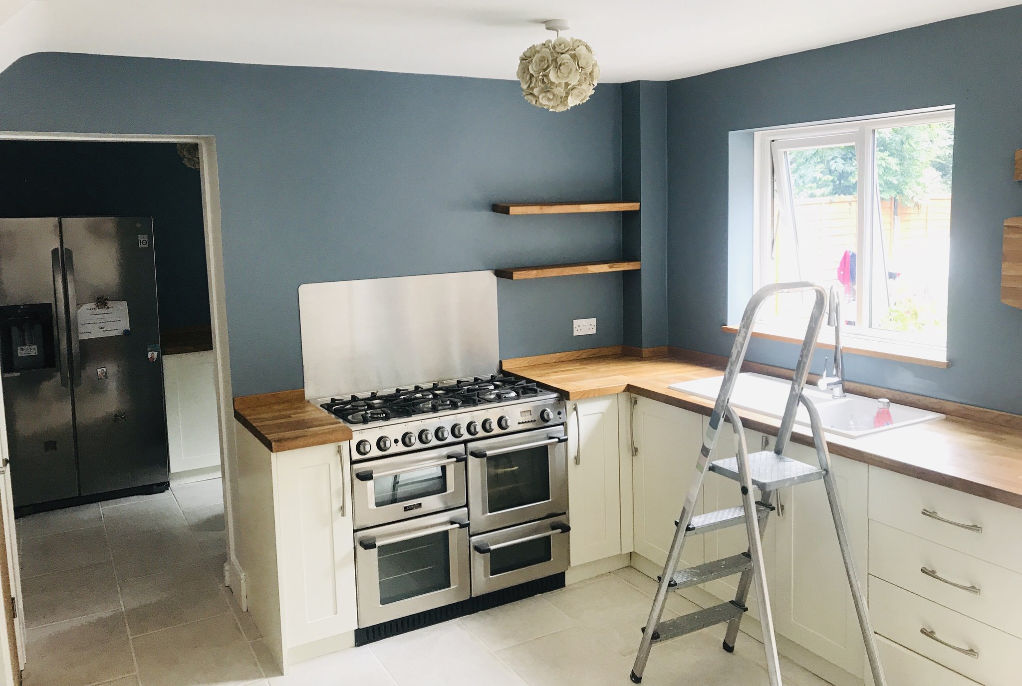 Kitchen walls in slate blue above cream units
